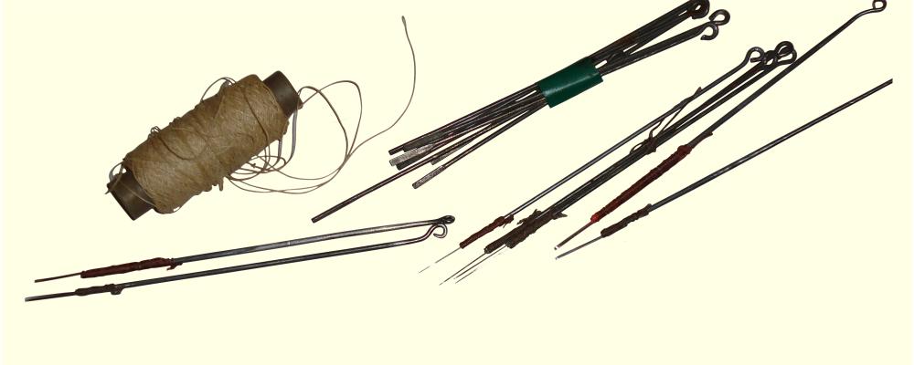 old-school-tattoo-needles-tied-with-cotton