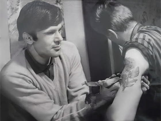 Tony Malo tattooing a rose in his Oxford studio 1960s